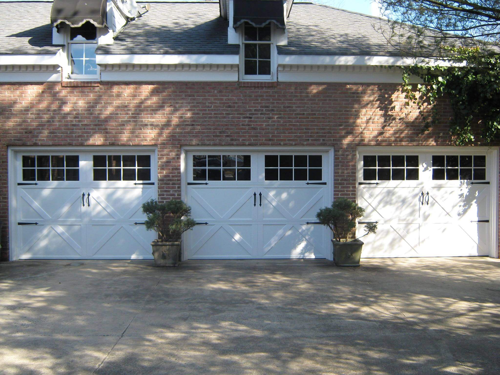 3 carriage house garage doors after professional installation