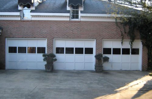 3 old garage doors before service