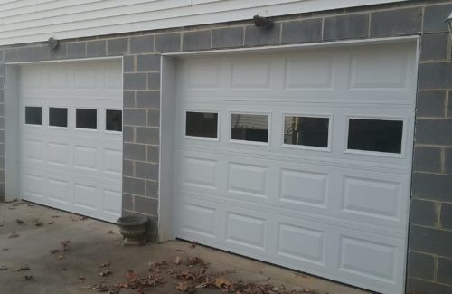 a brand new garage door after garage door specialists repaired it