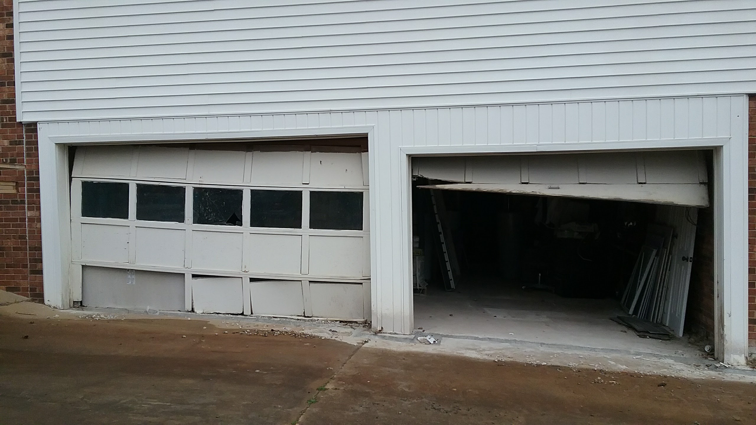 two broken garage doors in Lenoir North Carolina