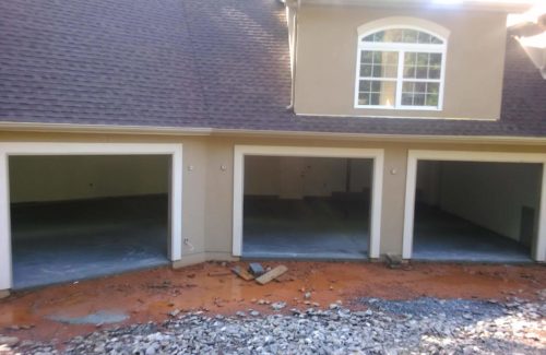 a new home with empty garage door frames